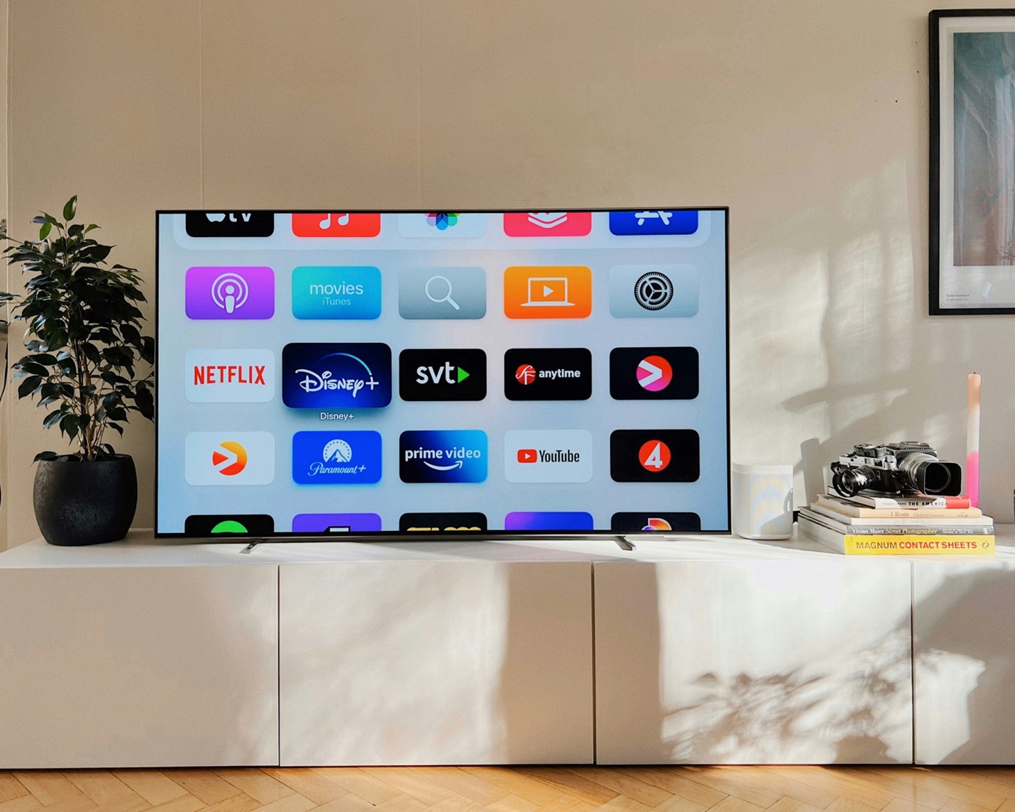 A flatscreen TV with a menu displaying a number of streaming services. Streaming in 4K requires more bandwidth than 1080p streaming bandwidth.