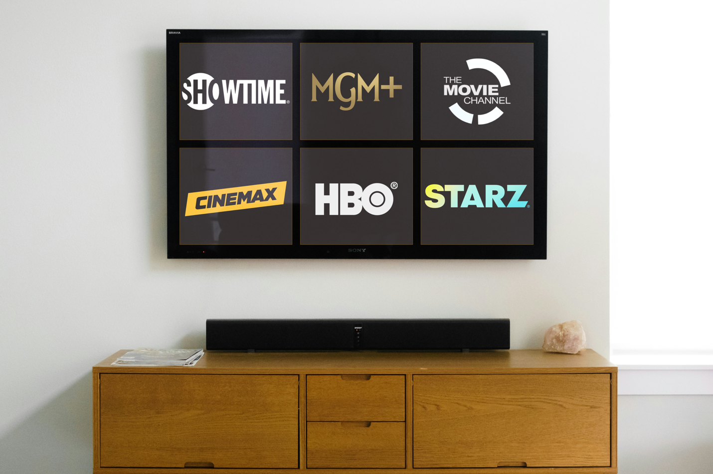 TV displaying a premium channel package, including logos from Showtime, MGM+, The Movie Channel, Cinemax, HBO, and Starz
