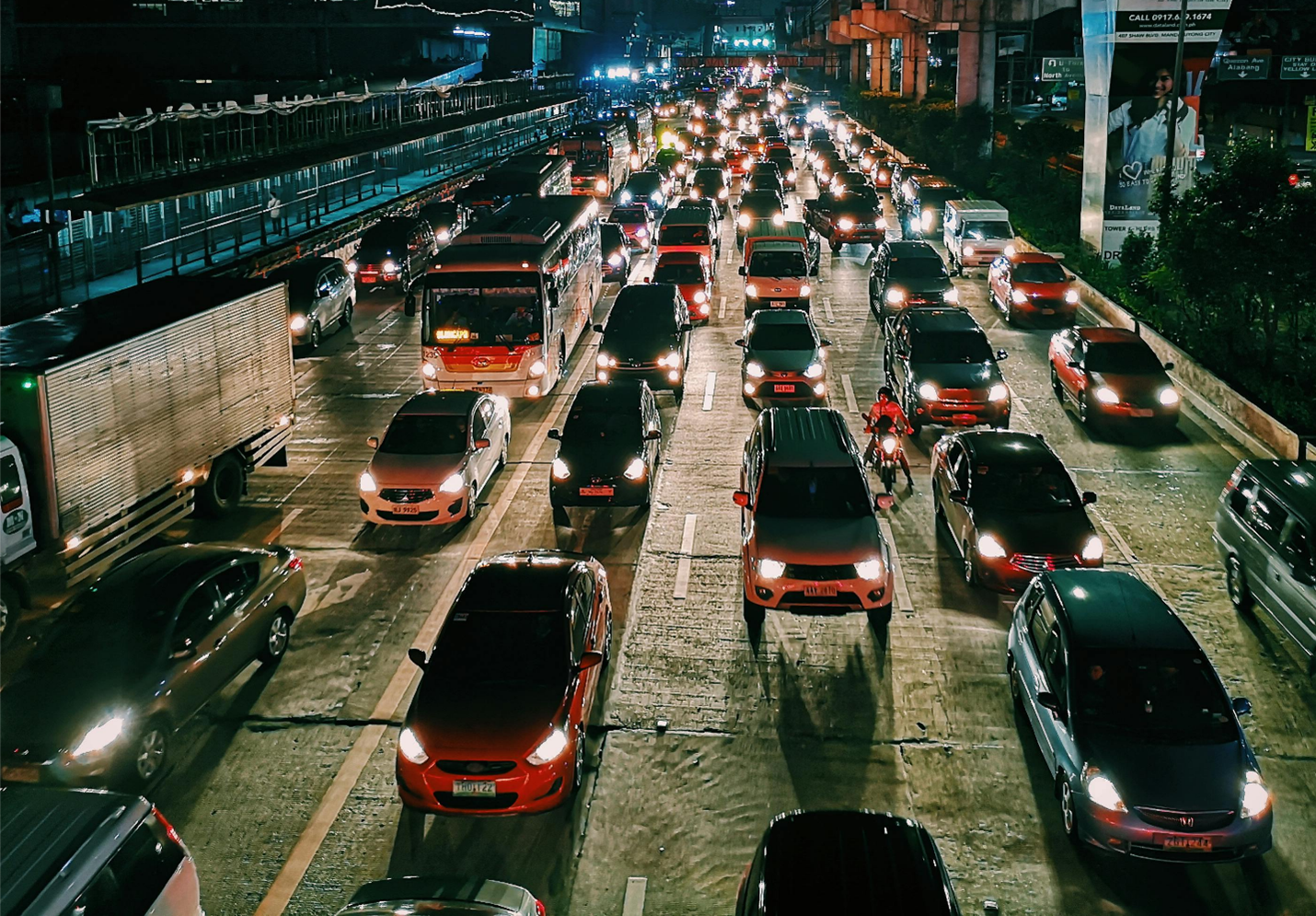 Heavy traffic on a multi-lane road representing network congestion and slow data transfer speeds